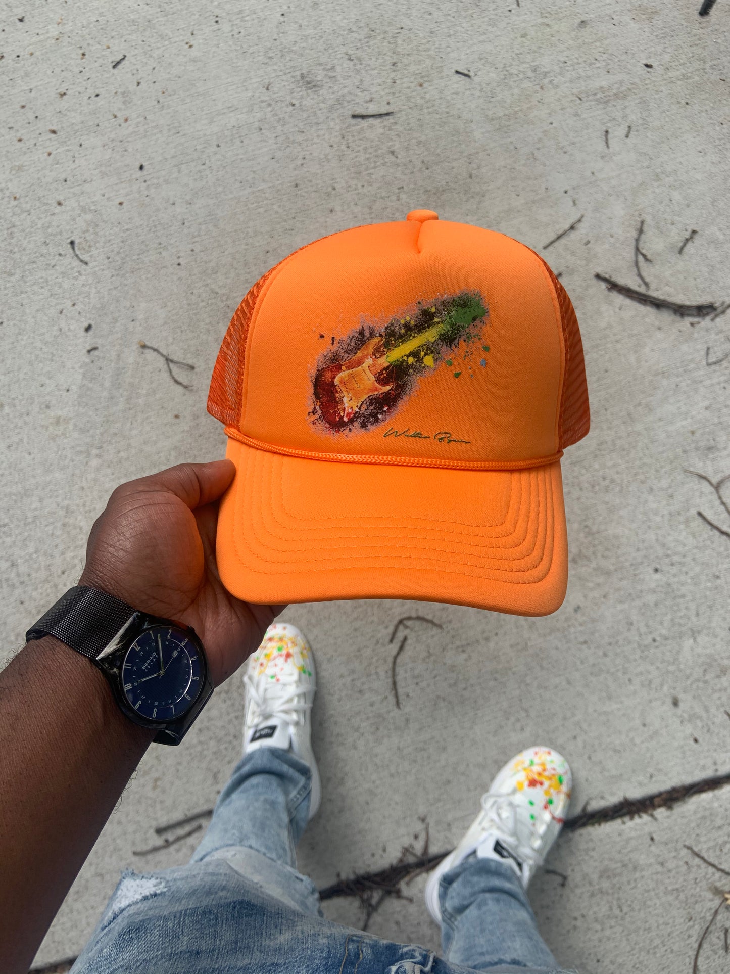 Orange guitar trucker hat